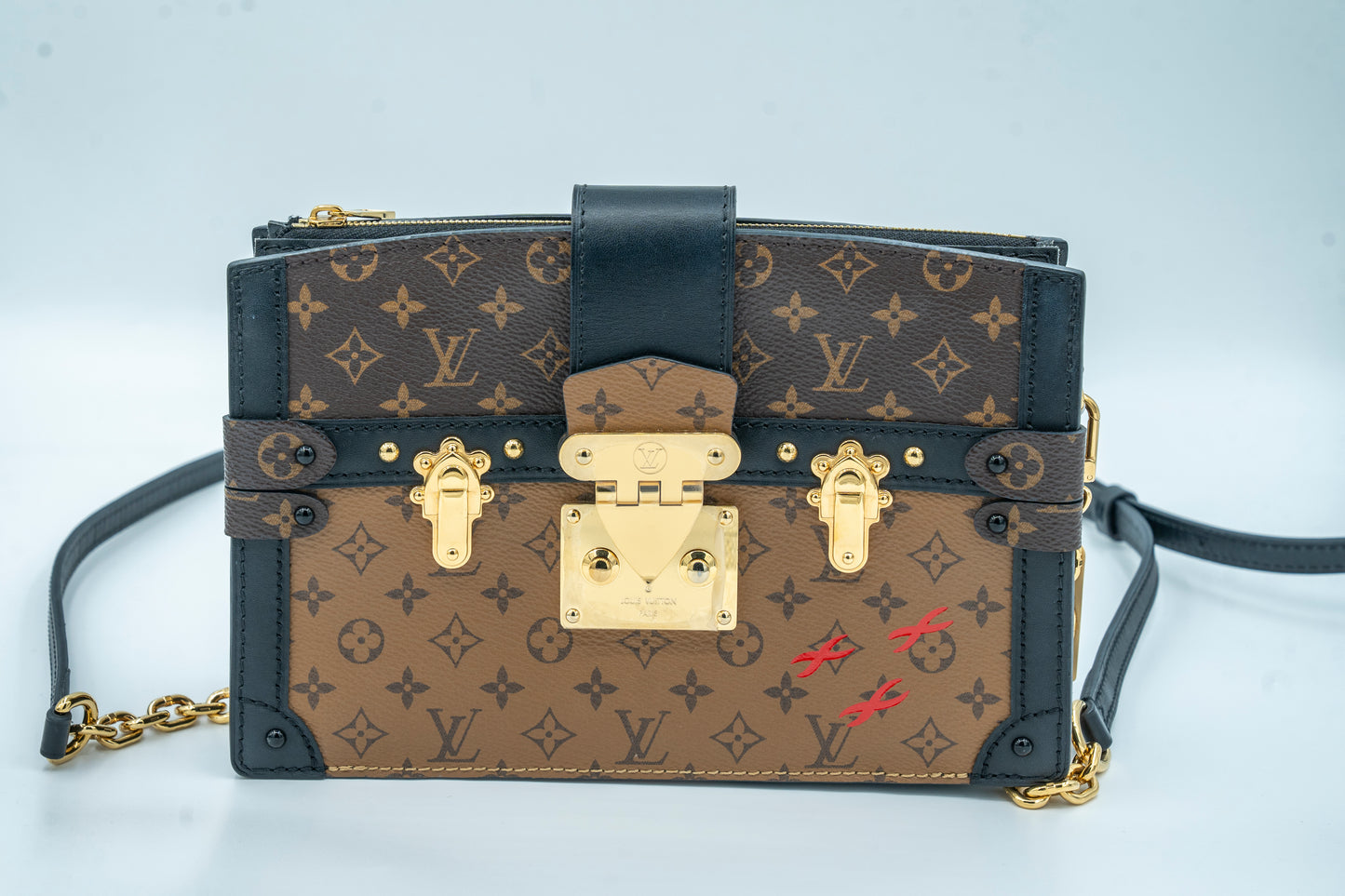 LOUIS VUITTON TRUNK CLUTCH REVERSE MONOGRAM