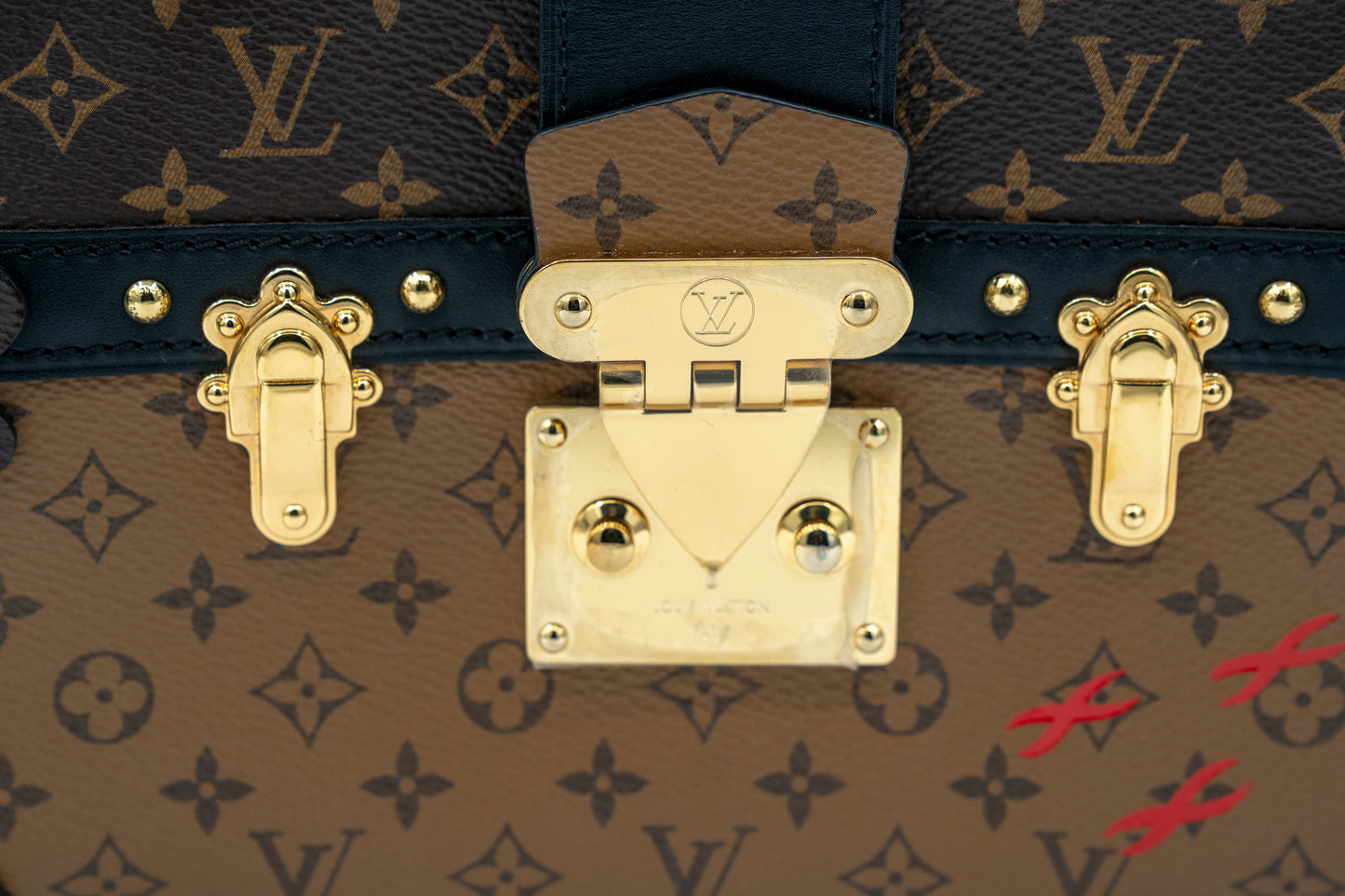 LOUIS VUITTON TRUNK CLUTCH REVERSE MONOGRAM