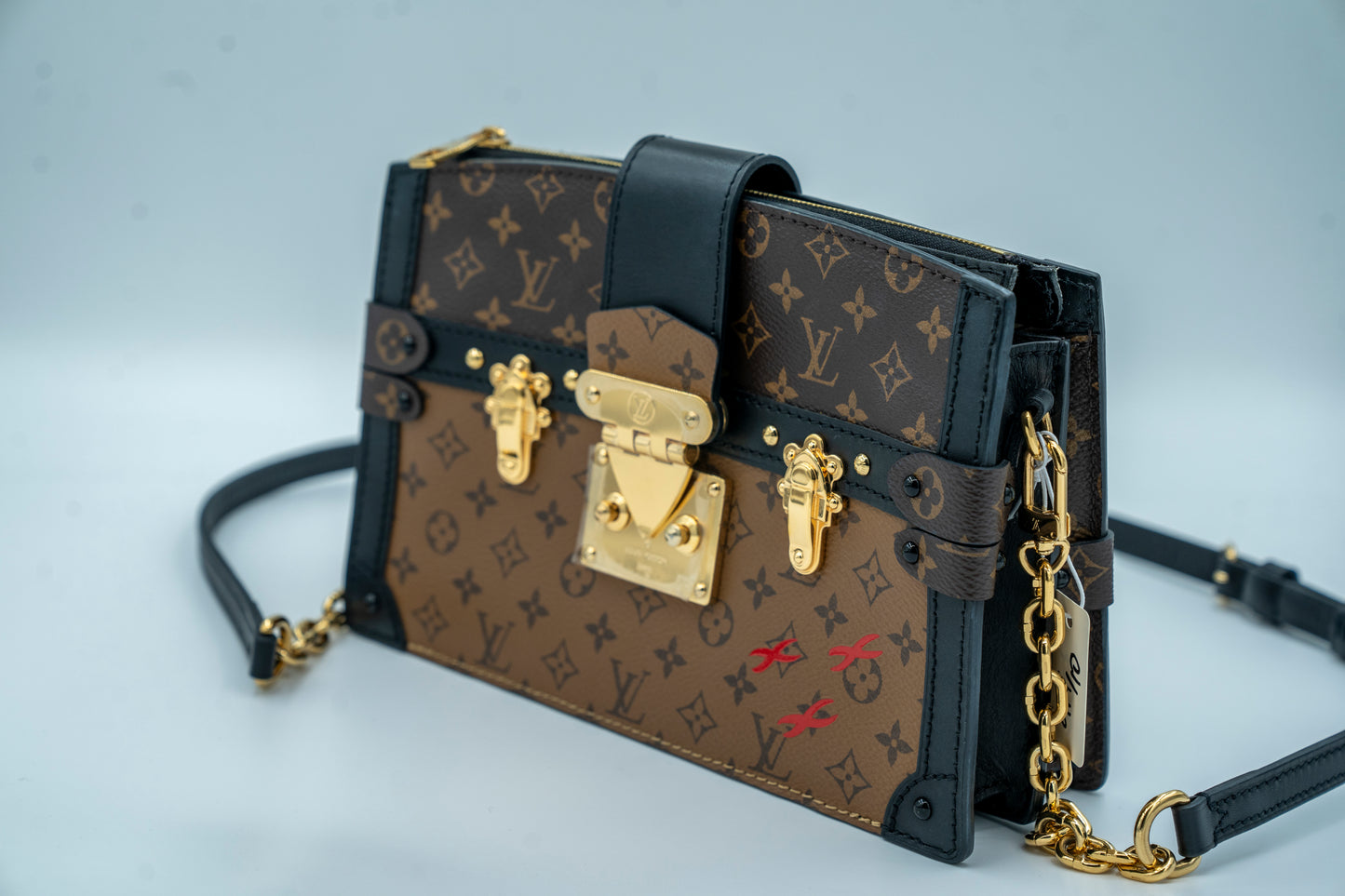 LOUIS VUITTON TRUNK CLUTCH REVERSE MONOGRAM