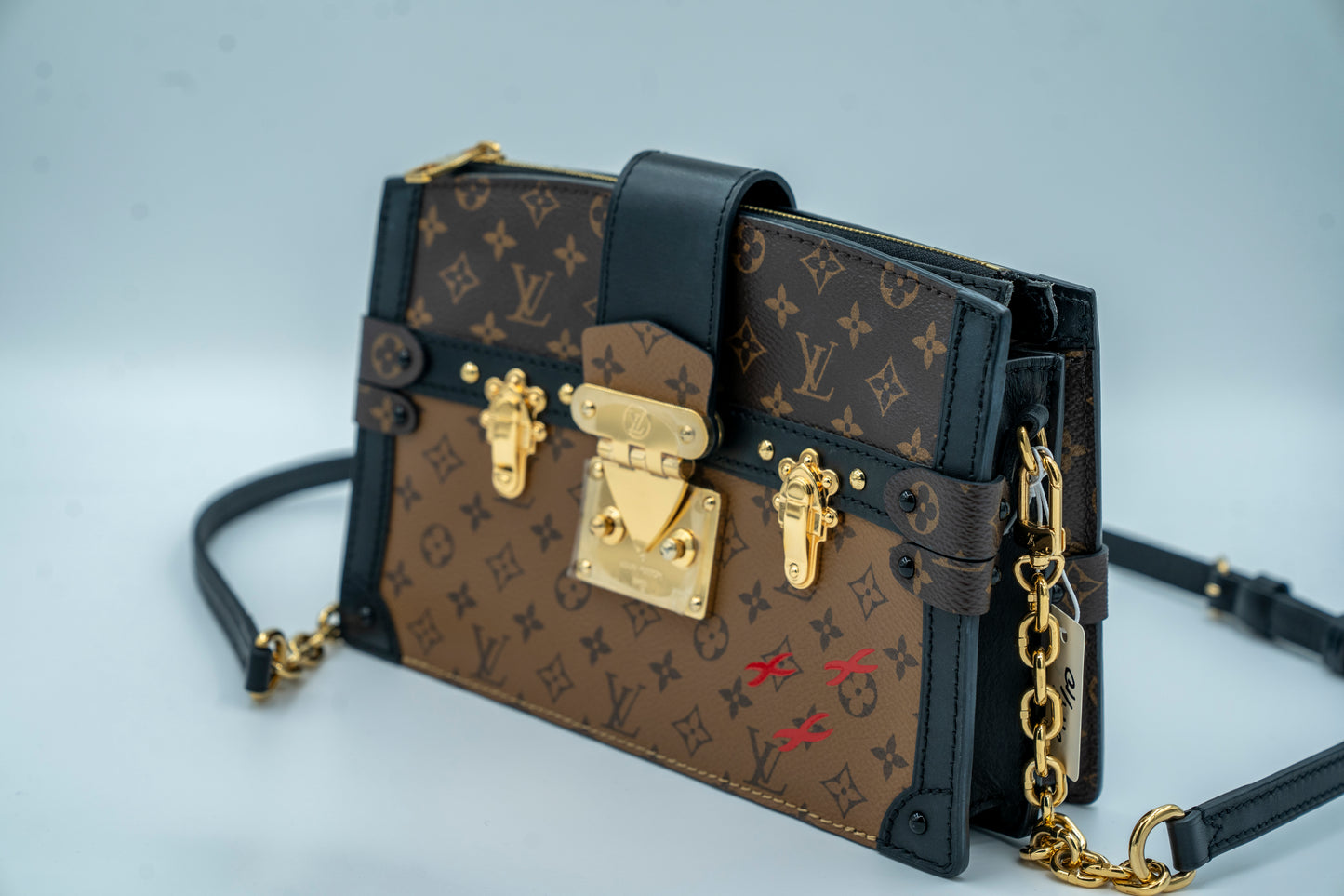 LOUIS VUITTON TRUNK CLUTCH REVERSE MONOGRAM