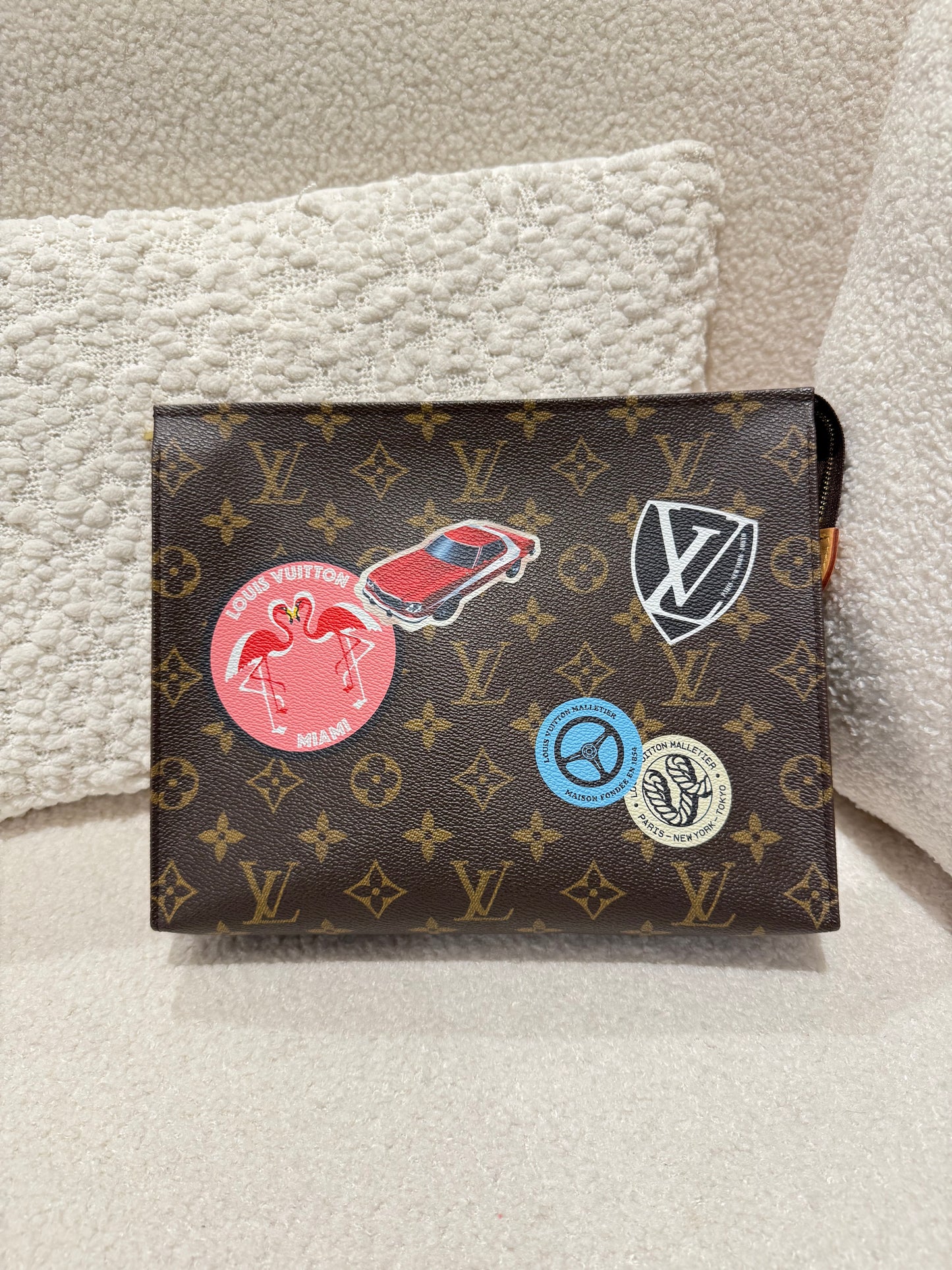 LOUIS VUITTON LIMITED BADGE POCHETTE VOYAGE MM